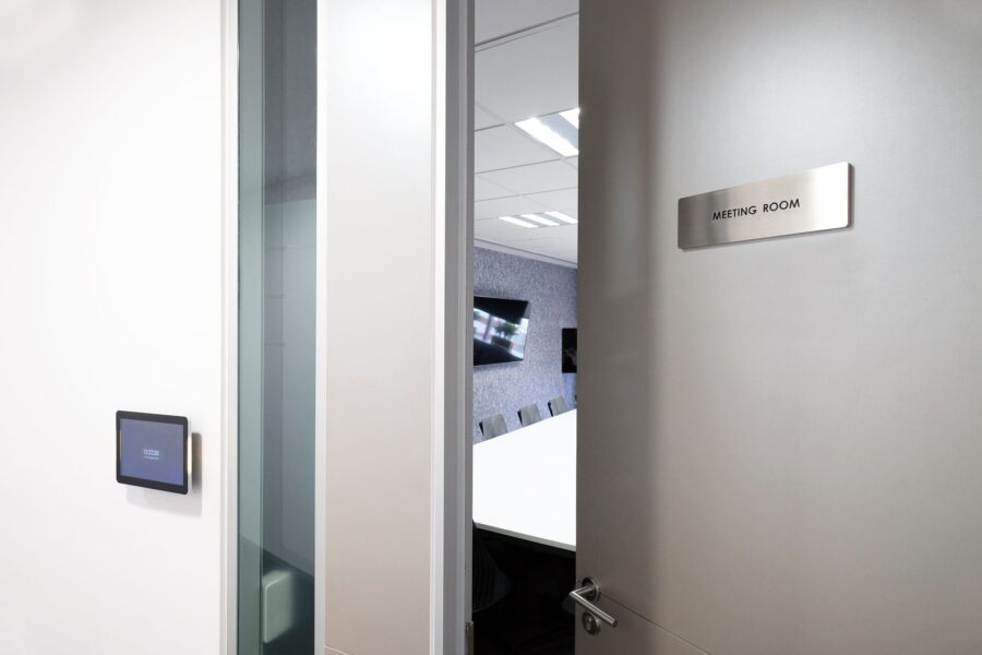 An open door to an empty meeting room in a modern office